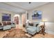 Cozy living room featuring hardwood floors, an animal hide rug, and two blue couches with hide accents at 732 Oak Ne St, St Petersburg, FL 33701