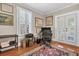 Bright home office space with shuttered windows, French doors, hardwood flooring, and a patterned rug at 732 Oak Ne St, St Petersburg, FL 33701