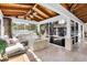 Outdoor screened-in patio featuring a ceiling fan, stone flooring, exterior access, and a stone firepit at 732 Oak Ne St, St Petersburg, FL 33701