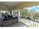 Inviting covered porch features comfortable seating and serene neighborhood views at 732 Oak Ne St, St Petersburg, FL 33701