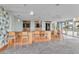 Community bar area with a counter, seating and multiple TV screens at 777 N Ashley Dr # 1915, Tampa, FL 33602