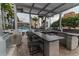 Rooftop barbecue area featuring seating, granite countertops, and stainless steel grill at 777 N Ashley Dr # 1915, Tampa, FL 33602