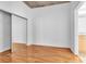 Bright bedroom with wood floors, neutral walls, closet with mirror doors and ensuite bath at 777 N Ashley Dr # 1915, Tampa, FL 33602