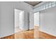 Cozy bedroom showing multiple doors, neutral walls, wood floors and overhead lighting at 777 N Ashley Dr # 1915, Tampa, FL 33602