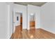 An open bedroom has wood flooring, white walls, and access to the bathroom and closet at 777 N Ashley Dr # 1915, Tampa, FL 33602