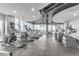 Modern gym with rows of treadmills, ellipticals, and stationary bikes overlooking the city at 777 N Ashley Dr # 1915, Tampa, FL 33602