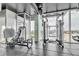 Bright gym features views of the city and ample weight training equipment at 777 N Ashley Dr # 1915, Tampa, FL 33602