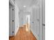 Bright hallway with hardwood floors and white doors, creating a clean and spacious atmosphere at 777 N Ashley Dr # 1915, Tampa, FL 33602