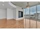 Spacious living room with hardwood floors, city views, and a modern lighting fixture at 777 N Ashley Dr # 1915, Tampa, FL 33602