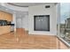 A spacious living area with modern built-ins, city views, and adjacent, light-filled kitchen at 777 N Ashley Dr # 1915, Tampa, FL 33602