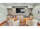 Lounge area featuring comfortable seating, shelving, and a TV at 777 N Ashley Dr # 1915, Tampa, FL 33602