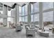 Community lounge with high ceilings, floor to ceiling windows, and comfortable seating at 777 N Ashley Dr # 1915, Tampa, FL 33602