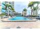Luxury pool with palm trees and benches creating an inviting space at 777 N Ashley Dr # 1915, Tampa, FL 33602