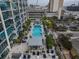 An aerial view of the inviting rooftop pool, surrounded by lush landscaping and city views at 777 N Ashley Dr # 1915, Tampa, FL 33602