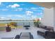 Relaxing balcony featuring comfortable seating and panoramic water views at 7892 Sailboat Key S Blvd # 107, South Pasadena, FL 33707