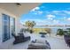 Serene balcony with outdoor seating and picturesque water views at 7892 Sailboat Key S Blvd # 107, South Pasadena, FL 33707