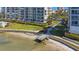 Waterfront condo with private beach access and a wooden dock on the Gulf Coast of Florida at 7892 Sailboat Key S Blvd # 107, South Pasadena, FL 33707