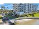 Coastal condo building with access to a sandy beach and a charming wooden pier at 7892 Sailboat Key S Blvd # 107, South Pasadena, FL 33707