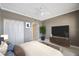 Staged bedroom with ceiling fan, closet, and ensuite bathroom at 7892 Sailboat Key S Blvd # 107, South Pasadena, FL 33707