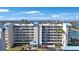 Beautiful multi-story condo building with manicured landscaping and ocean views at 7892 Sailboat Key S Blvd # 107, South Pasadena, FL 33707