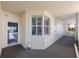 Inviting hallway entrance featuring a window with shutters and view at 7892 Sailboat Key S Blvd # 107, South Pasadena, FL 33707