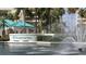 Beautiful Harbour Side entrance sign near a pond with palm trees and beige buildings at 7892 Sailboat Key S Blvd # 107, South Pasadena, FL 33707
