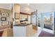 Open kitchen with granite countertops, white cabinets and stainless appliances at 7892 Sailboat Key S Blvd # 107, South Pasadena, FL 33707