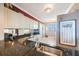 Cozy kitchen featuring dark granite counters and white appliances at 7892 Sailboat Key S Blvd # 107, South Pasadena, FL 33707