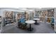 Cozy library filled with bookshelves, reading chairs, and tables for quiet study at 7892 Sailboat Key S Blvd # 107, South Pasadena, FL 33707