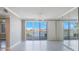 Bright living room with sliding glass doors leading to a balcony and mirrored wall at 7892 Sailboat Key S Blvd # 107, South Pasadena, FL 33707
