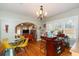 Open-concept dining area with a stylish bar, seating, and easy access to the living room at 907 E Hamilton Ave, Tampa, FL 33604