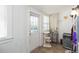Bright sunroom with tiled floors, white shiplap walls, and abundant natural light streaming through large windows at 907 E Hamilton Ave, Tampa, FL 33604