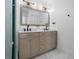 Bright bathroom with double sinks, marble countertop, and modern fixtures at 919 38Th Ne Ave, St Petersburg, FL 33704