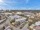 Scenic aerial perspective showing a cozy apartment community with swimming pool, parking, and serene neighborhood setting at 100 Waverly Way # 101, Clearwater, FL 33756