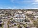 Overhead shot capturing the well-arranged apartment complex surrounded by greenery, street parking, and nearby city buildings at 100 Waverly Way # 101, Clearwater, FL 33756