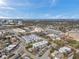 Expansive aerial view of a residential community with well-maintained townhouses, apartments, and landscaping at 100 Waverly Way # 101, Clearwater, FL 33756