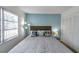 Comfortable bedroom features natural light, built-in closet, and nautical themed decor at 100 Waverly Way # 101, Clearwater, FL 33756