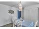 Cozy dining room features a charming macrame light fixture and seating for four at 100 Waverly Way # 101, Clearwater, FL 33756