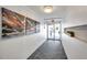 Well-maintained hallway featuring modern art and an exit to the exterior, ensuring easy access and aesthetic appeal at 100 Waverly Way # 101, Clearwater, FL 33756