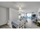 This open living and dining space features tile floors and bright, coastal decor at 100 Waverly Way # 101, Clearwater, FL 33756