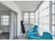 Cozy sunroom with comfortable seating and bright natural light, offering a relaxing space at 100 Waverly Way # 101, Clearwater, FL 33756