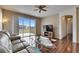 Comfortable living room with sliding glass doors to the backyard and a cozy seating area at 10328 Celtic Ash Dr, Ruskin, FL 33573