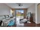 Inviting living room with sliding glass doors providing backyard views and lots of natural light at 10328 Celtic Ash Dr, Ruskin, FL 33573