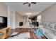 Cozy living space featuring hardwood floors, a ceiling fan, and seamless flow to other living areas at 10328 Celtic Ash Dr, Ruskin, FL 33573