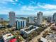 Stunning aerial view of city buildings near the harbor under a bright, partly cloudy sky at 105 4Th Ne Ave # 418, St Petersburg, FL 33701