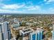 Expansive aerial view showcases city buildings surrounded by lush greenery on a sunny day at 105 4Th Ne Ave # 418, St Petersburg, FL 33701