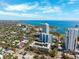 Scenic aerial view of coastal city with a harbor, blue ocean, and vibrant buildings under a sunny sky at 105 4Th Ne Ave # 418, St Petersburg, FL 33701