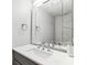 Modern half bath with white marble sink and countertops, and chrome faucet fixtures at 105 4Th Ne Ave # 418, St Petersburg, FL 33701