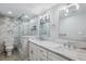 Elegant bathroom featuring marble countertops, modern fixtures, and a glass-enclosed shower at 105 4Th Ne Ave # 418, St Petersburg, FL 33701