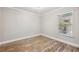 Bright bedroom with natural light, wood floors, and a window with blinds at 105 4Th Ne Ave # 418, St Petersburg, FL 33701